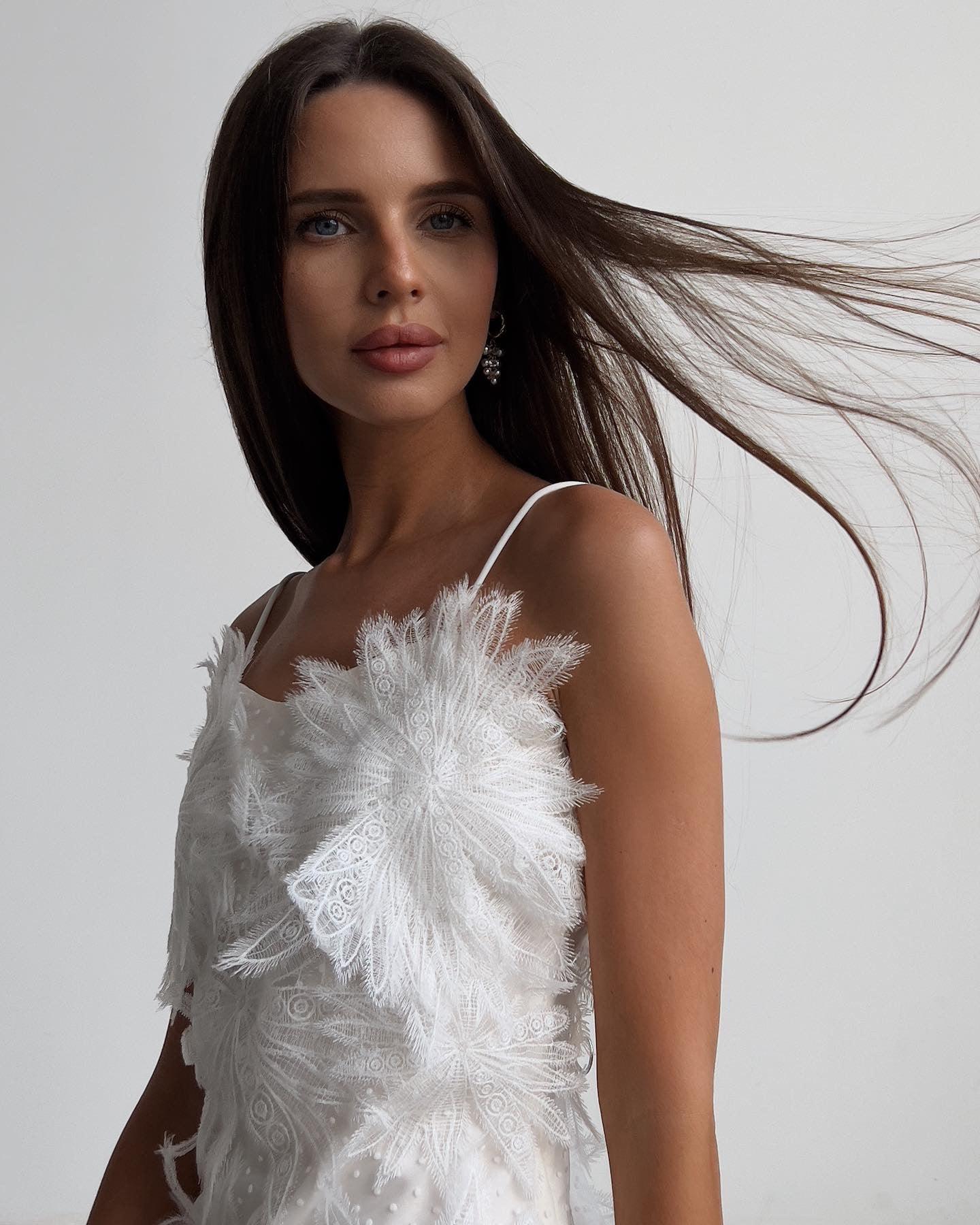 Feathered Elegance Mini Dress.