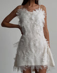 Feathered Elegance Mini Dress.